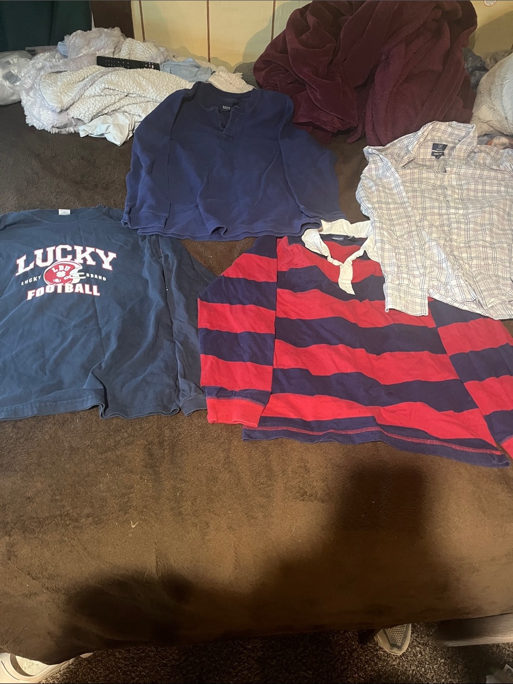 Four men's long sleeve shirts